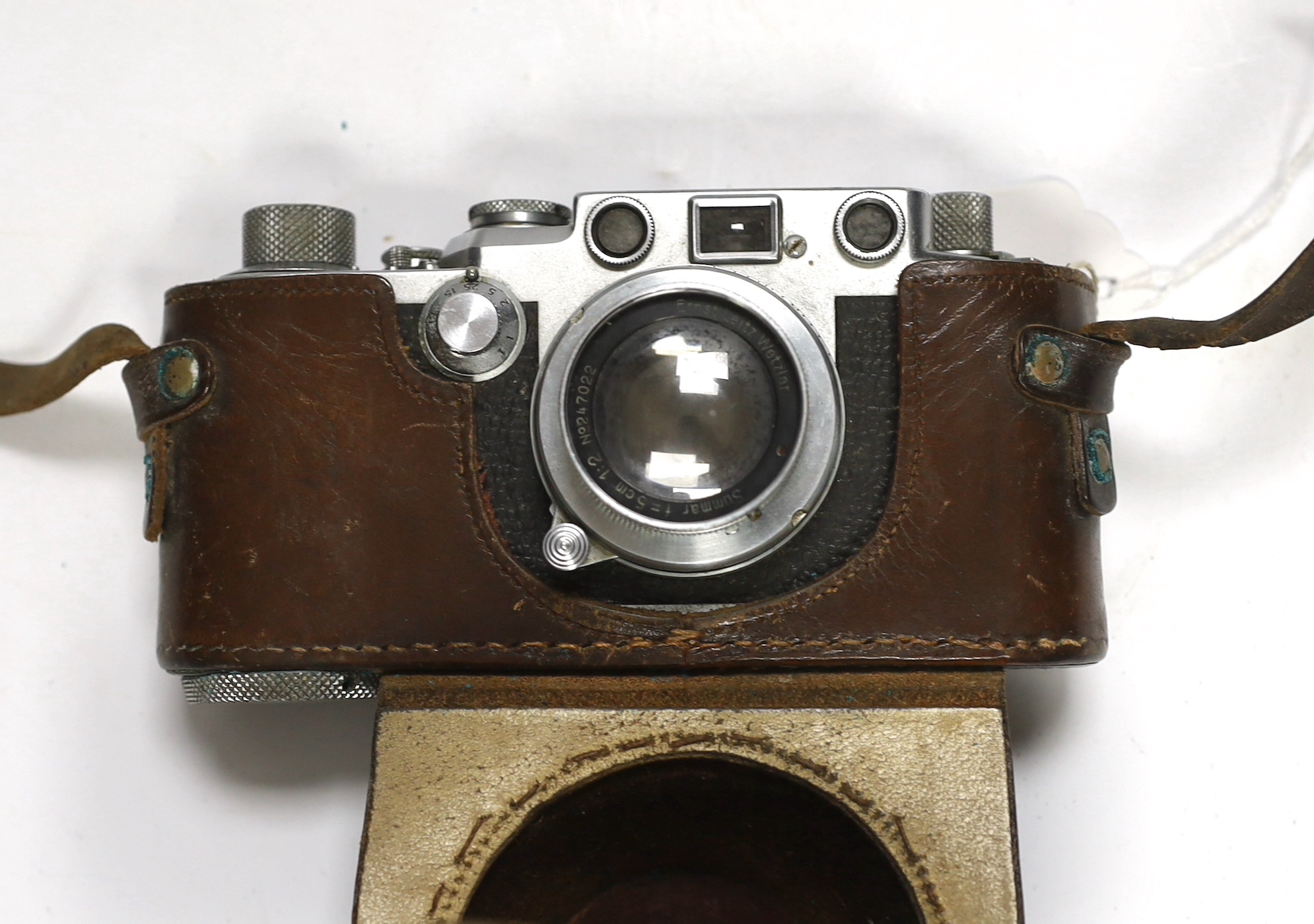 A Leica IIIf camera, Nr.646305, with summar f=5cm 1:2 lens, with leather case with strap